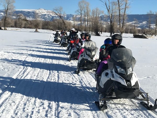 a group of people that are standing in the snow