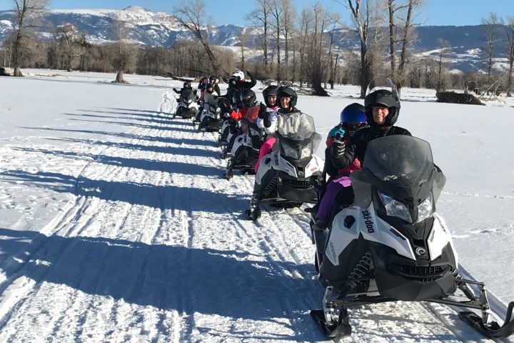 a group of people that are standing in the snow