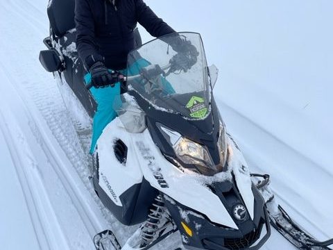 a man that is standing in the snow